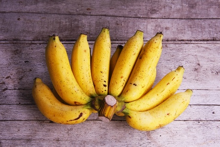Bunch of bananas on woodenの写真素材
