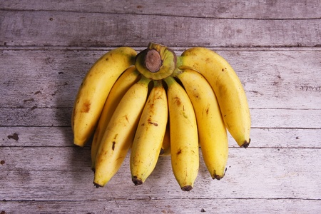 Bunch of bananas on woodenの写真素材