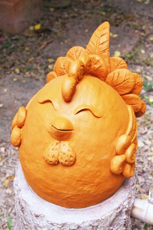 chicken baked clay dolls ornamental in the gardenの写真素材