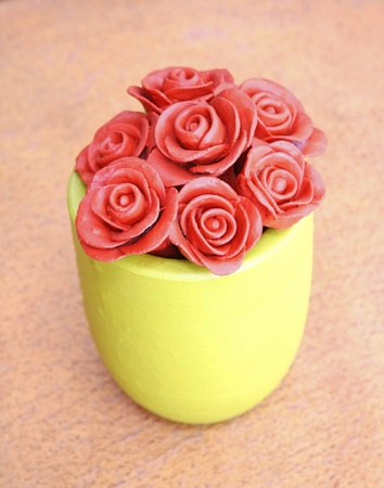 Vase of roses  baked clay ornamental in the gardenの写真素材