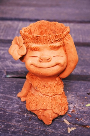 little girl baked clay dolls  for decorate garden and houseの写真素材