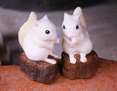 two squirrels baked clay dolls  for decorate garden and houseの写真素材