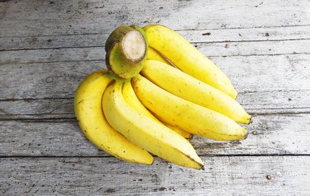 Bunch of bananas on wooden の写真素材