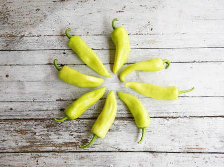 still life with Green peppers on wooden table の写真素材