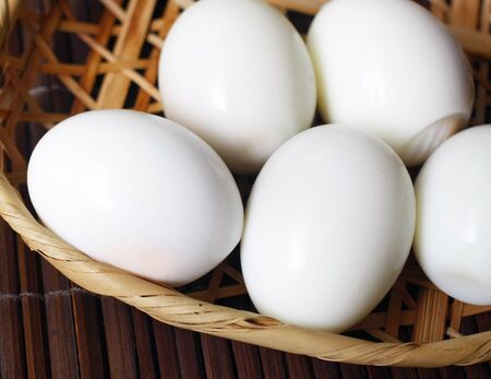 Boiled eggs on bamboo tray.の写真素材