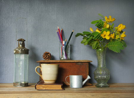 still life with tea cup and vintage objects on wooden table.の写真素材