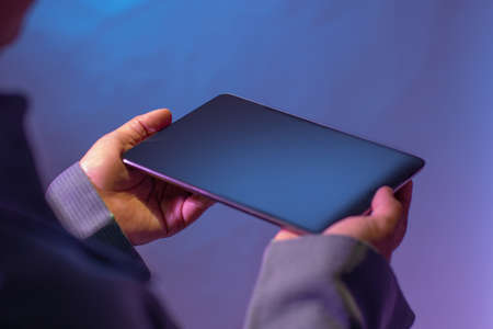 Holding facing up position digital tablet. Smart business technology concept.