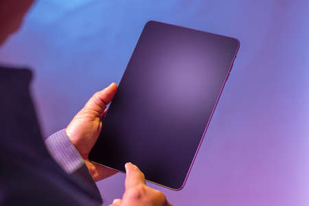 Using digital tablet for business and marketing. Business technology concept. Isolated on blue...