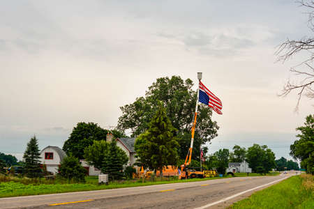 GRAND LEDGE, MI - July 11TH: Flying upside down American flag as a sign of distress in Grand Ledge on July 11th, 2021.のeditorial素材