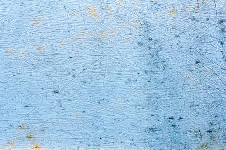 Faded and distress light blue automotive paint, background texture.