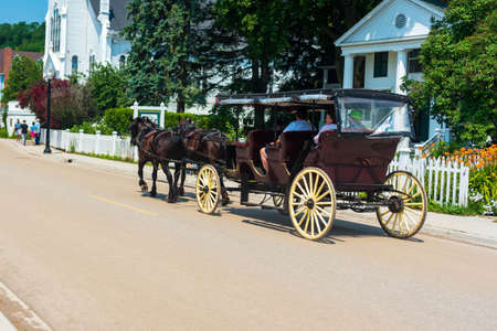 Mackinaw Island, MI - July 14, 2021: Horse drawn carriage on Mackinac Island, MI on July 14, 2021.のeditorial素材