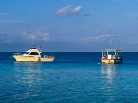 BONAIRE - OCTOBER 6, 2013: Resort dive boats anchored in bayのeditorial素材