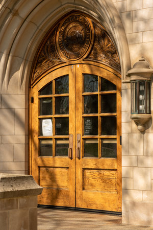 East Lansing MI - May 14, 2022: Doors and engraved emblem above a doorのeditorial素材