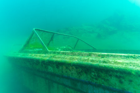 Wreck of recreational speed boat scuttled in a quarry as a scuba diving siteの写真素材
