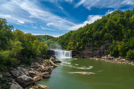 Cumberland Falls with a blue sky with clouds in Corbin, Kentucky, USAの写真素材