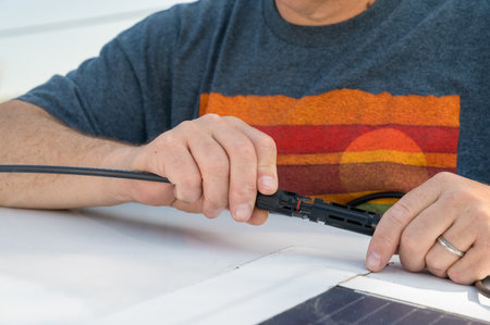 Hands Assembling Solar Power System with Copy-Space