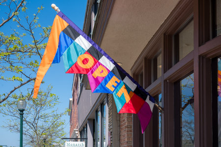 Petoskey, MI - May 18th, 2024: Colorful Open Sign on Building with Copy-Space