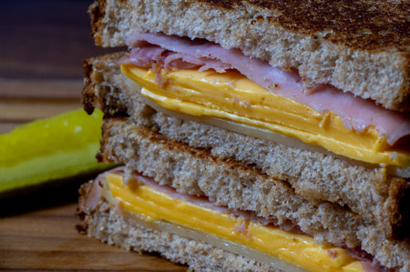 Stacked Grilled Ham and Cheese Sandwich with Pickleの写真素材