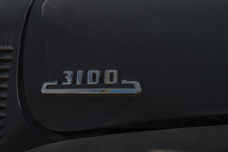 Charlotte, MI - April 26, 2025: Close Up of 1953 Chevrolet 3100 Truck Emblem with Copy-Space
