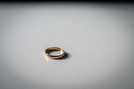 gold ring on white tableの写真素材