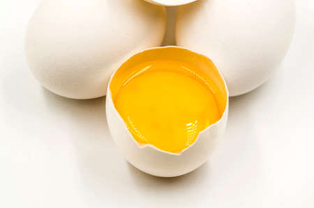 fresh eggs with yellow yalk on the black backgroundの写真素材