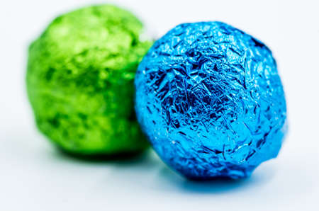 colorful gift balls with candies or tea on white backgroundの写真素材