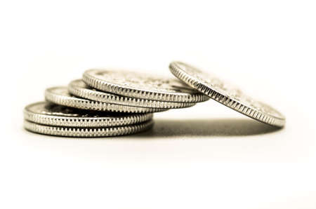 metal chinese coins pile fall down on the white backgroundの写真素材
