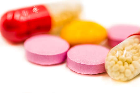 colorful medicine pills on the white backgroundの写真素材