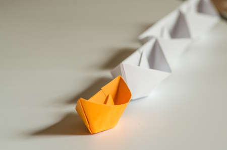 leadership concept. paper ships follow the leader origami ship