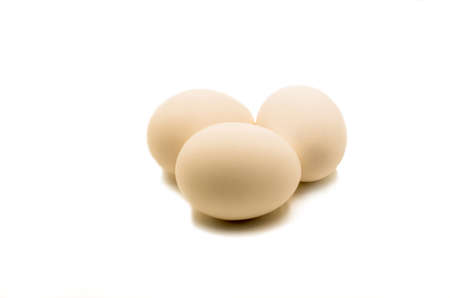 fresh brown eggs on the white backgroundの写真素材