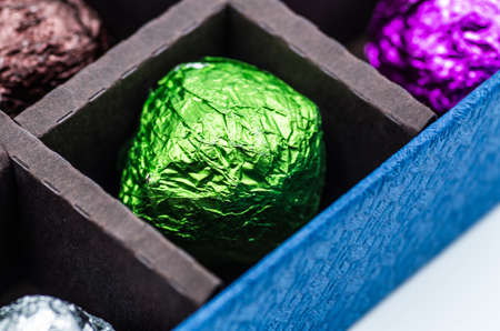 colorful gift balls with candies or tea in the boxの写真素材
