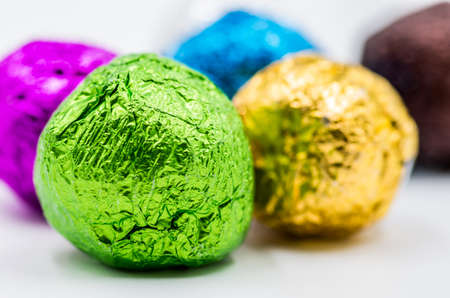 colorful gift balls with candies or tea on white backgroundの写真素材