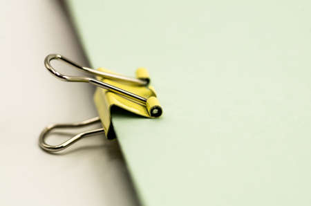 colorful paper clips on the white background