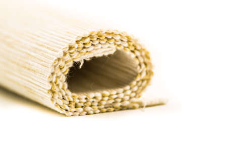 fair linen texture fabric in a roll on white