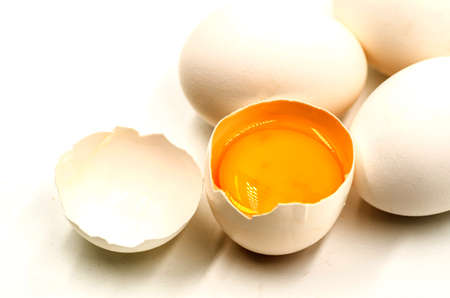 fresh eggs with yellow yalk on the black backgroundの写真素材