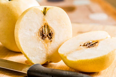 juicy pears isolated on the cutting boardの写真素材