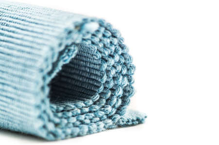 fair linen texture fabric in a roll on whiteの写真素材