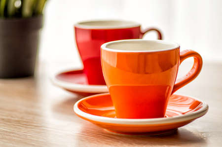 still life colorful tea cups on the wooden tableの写真素材