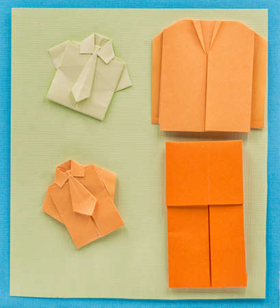 origami paper man office suit on textured colorful backgroundの写真素材