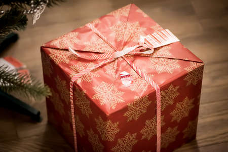 Big Christmas gift box on the floor inside.Merry Christmas concept