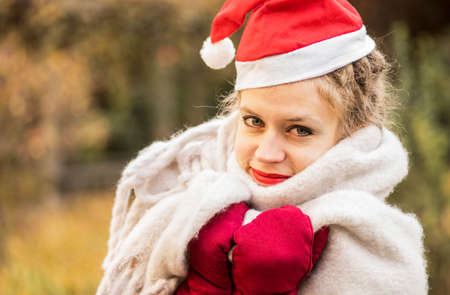european woman wearing christmas hatの写真素材