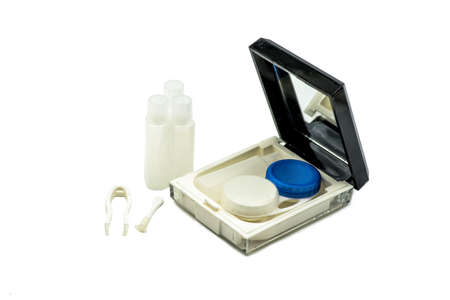 contact lenses set with a container, bottles and tweezers isolated on whiteの写真素材