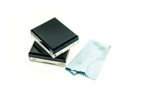 Contact lenses container, lens case and soft cleaning cloth on white background