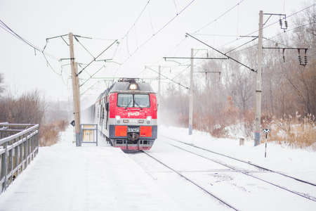 transportation. train arriving at the railway station in winter