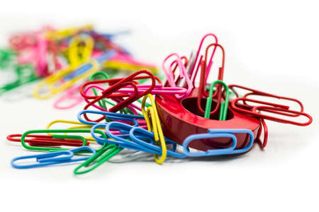 Magnet and paper clips isolated on a white backgroundの写真素材