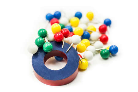 round red and blue magnet attracting metal paper pinsの写真素材