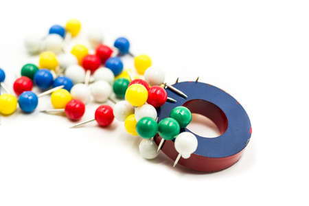 round red and blue magnet attracting metal paper pinsの写真素材
