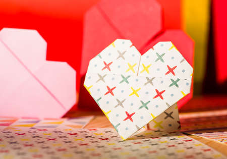 valentine's day concept. origami paper heart on colorful paperの写真素材