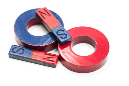 four red and blue magnets isolated on white backgroundの写真素材