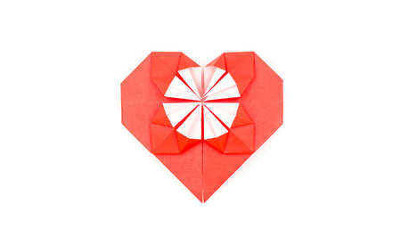 valentine's day. a red origami heart isolated on white backgroundの写真素材